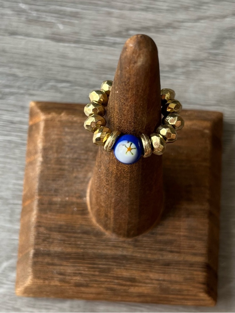 Gold Beaded Ring with Blue and White Star Accent